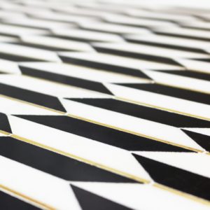 Polarized Brass Line With White Thassos  Nero Marquina