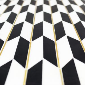 Polarized Brass Line With White Thassos  Nero Marquina